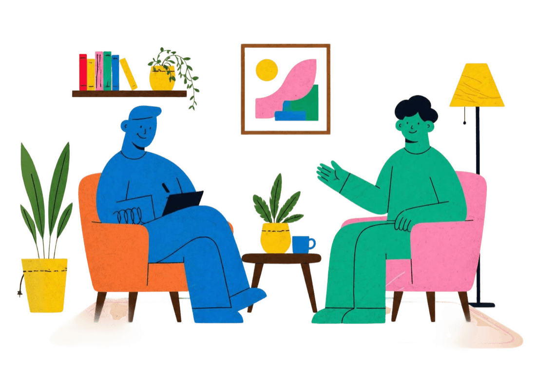A therapist and client talking in armchairs