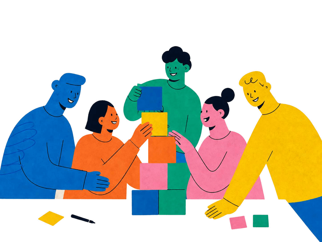 Colleagues building a structure of blocks together